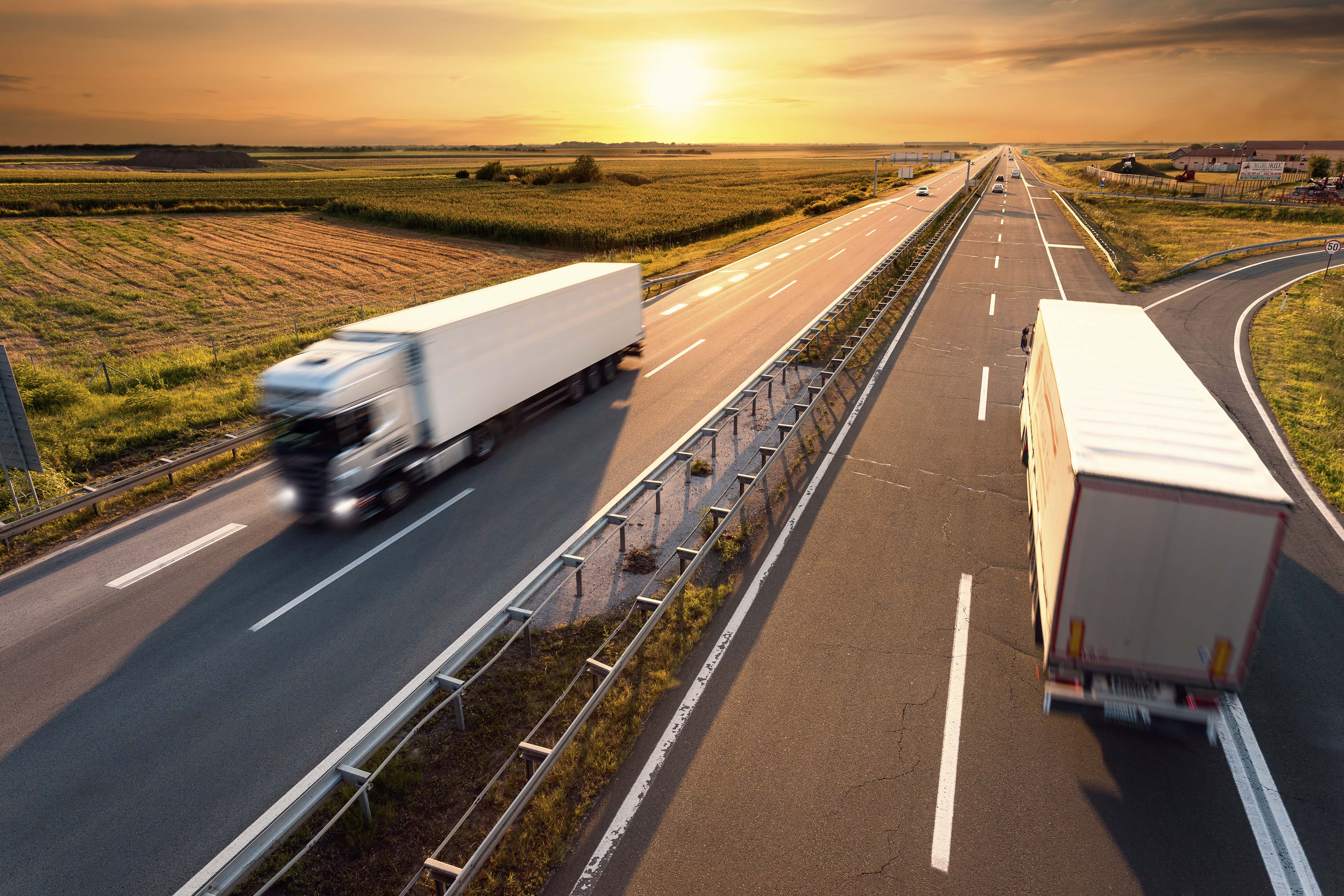 Trucks zooming on highway