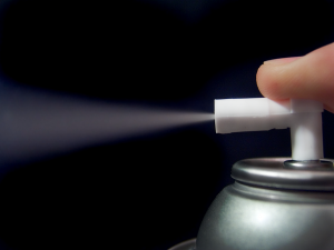 Butane being sprayed from an aerosol spray can