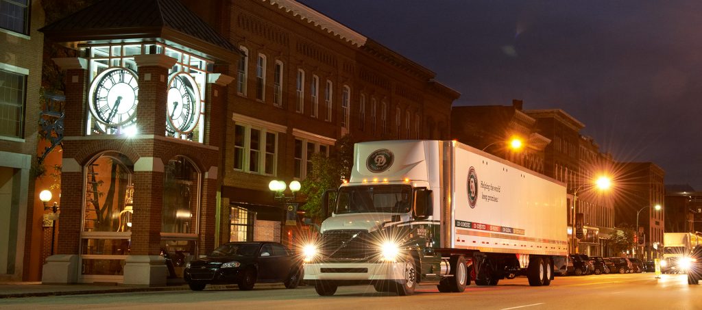 Old Dominion Freight Line Truck at night next to old brick building