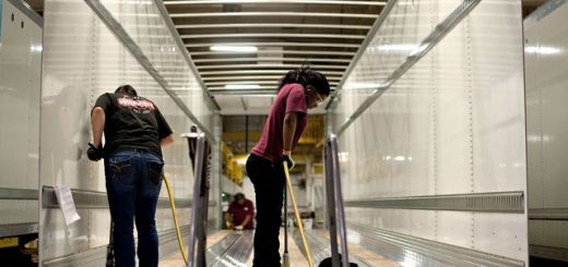 Workers drill holes to secure flooring to the frame of a semi trailer at the Wabash National Corp. facility in Lafayette Indiana