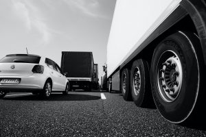 Trucks and cars on Highway bumper to bumper, EU Heavy Vehicle Emissions Deadline: A Challenging Path to Greener Transportation