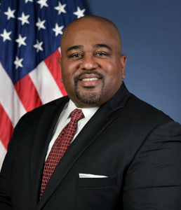 FMCSA Head Earl Adams Jr., New FMCSA Head Earl Adams Jr. posing in front of US flag