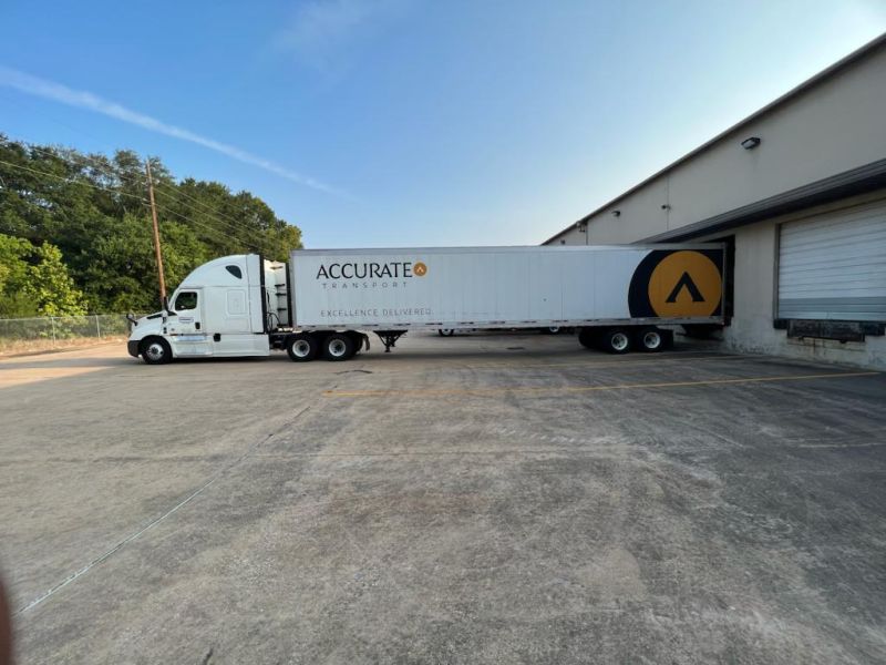 Accurate Transport Terminal with truck and trailer at dock