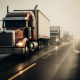 Various trucks driving on a highway in the rain