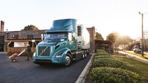 Volvo Trucks North America VNR-Electric being used for deliveries to store in sunset